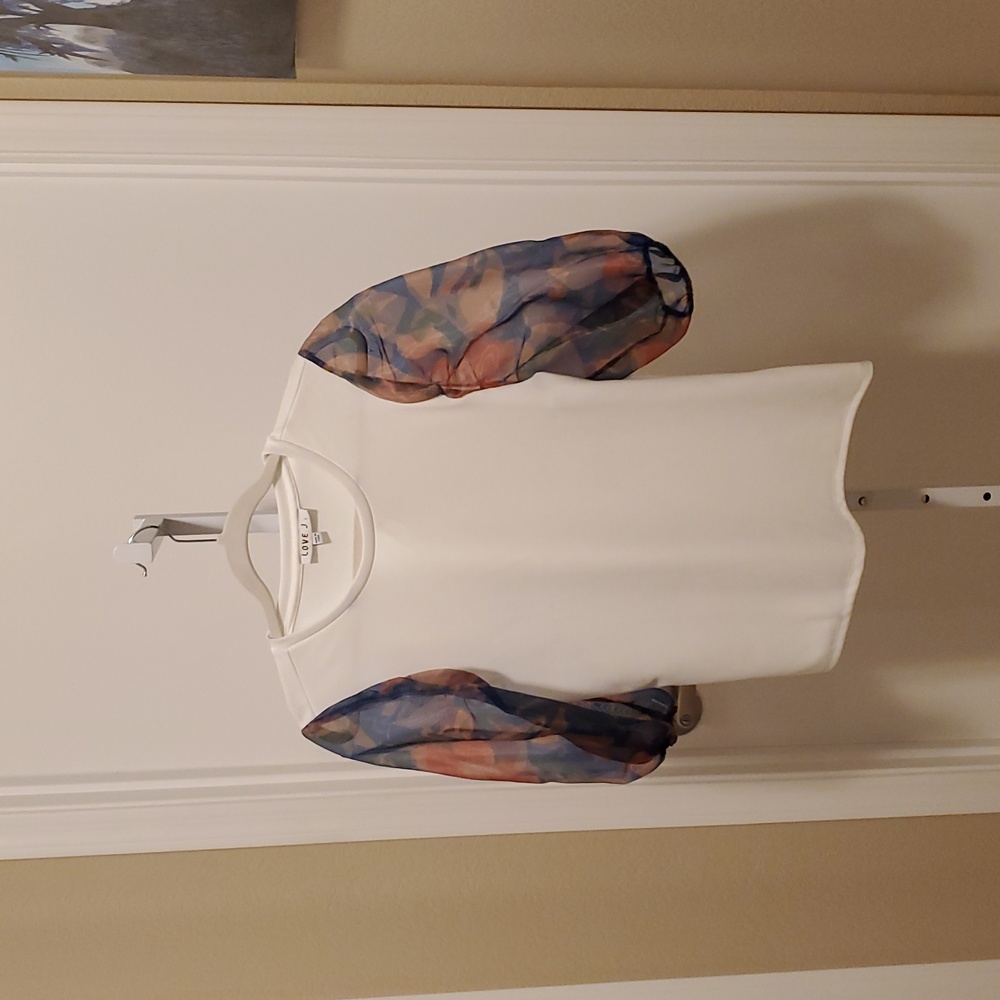 3. Tops- Love J top featuring sheer floral print sleeves
